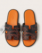 Hermes - Izmir Sandals in Black and Orange Leather