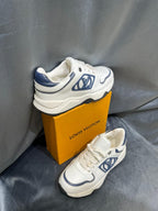 Louis Vuitton - Junior Low-Top Sneakers | White Leather with Blue Monogram Detail