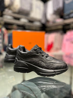 Gucci - Junior Black Sneakers with Embossed Details and Thick Sole