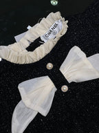 Chanel - Baby Black Shimmer Knit Romper with Ruffle Collar & Dual Silk Bows