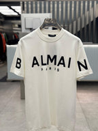 Balmain - Paris Logo Print Cotton T-Shirt in Off-White with Black Raised Lettering