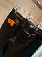 Hermès - Dark Brown Coated Denim Jeans