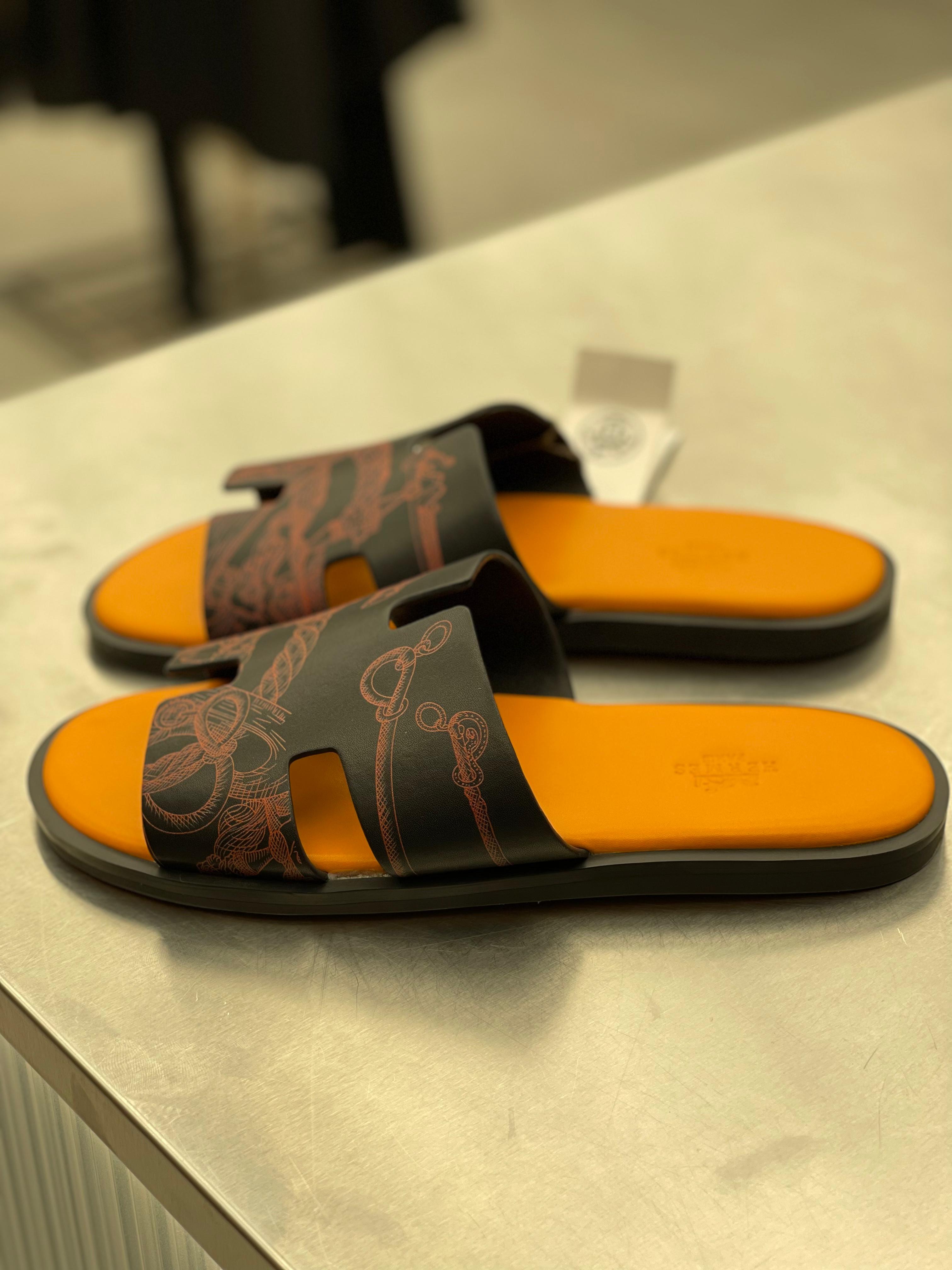 Hermes - Izmir Sandals in Black and Orange Leather